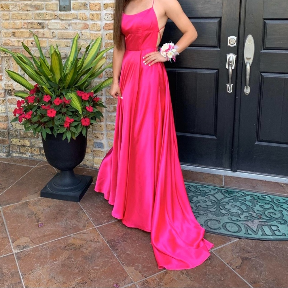 Sherri Hill Hot pink long prom/formal occasion dress with short train.